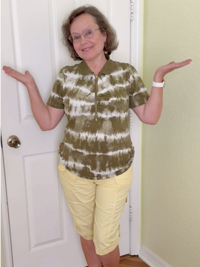 a woman wearing a tshirt shortened temporarily using magnetic clothing clips