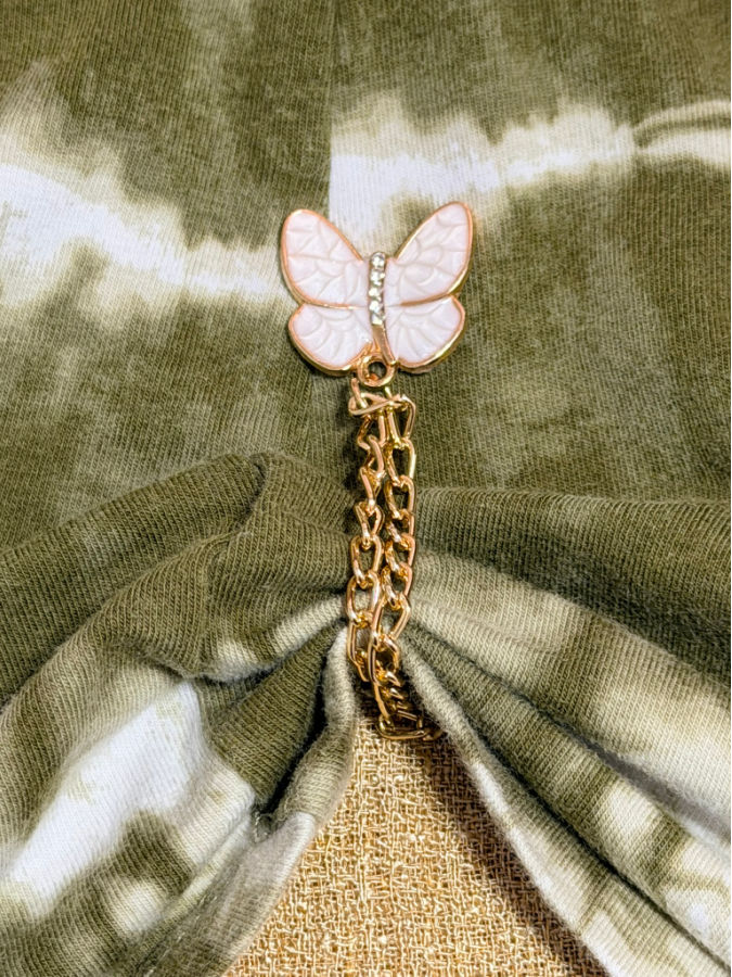close up image of the magnetic clothing clip installed on a thirt
