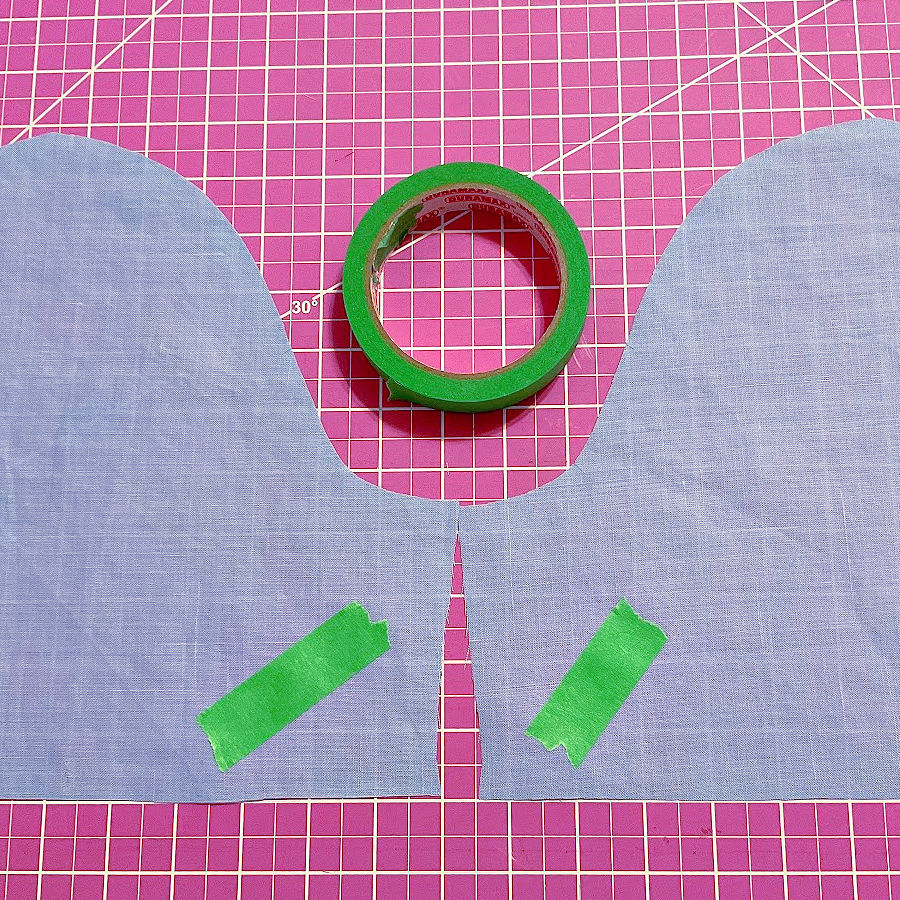 two pieces of material which look the same o n both sides marked with painters tape on the wrong side