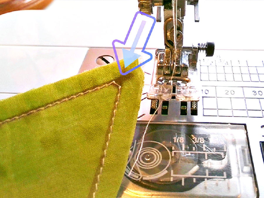 a close up of a seam around a corner showing one single diagonal stitch