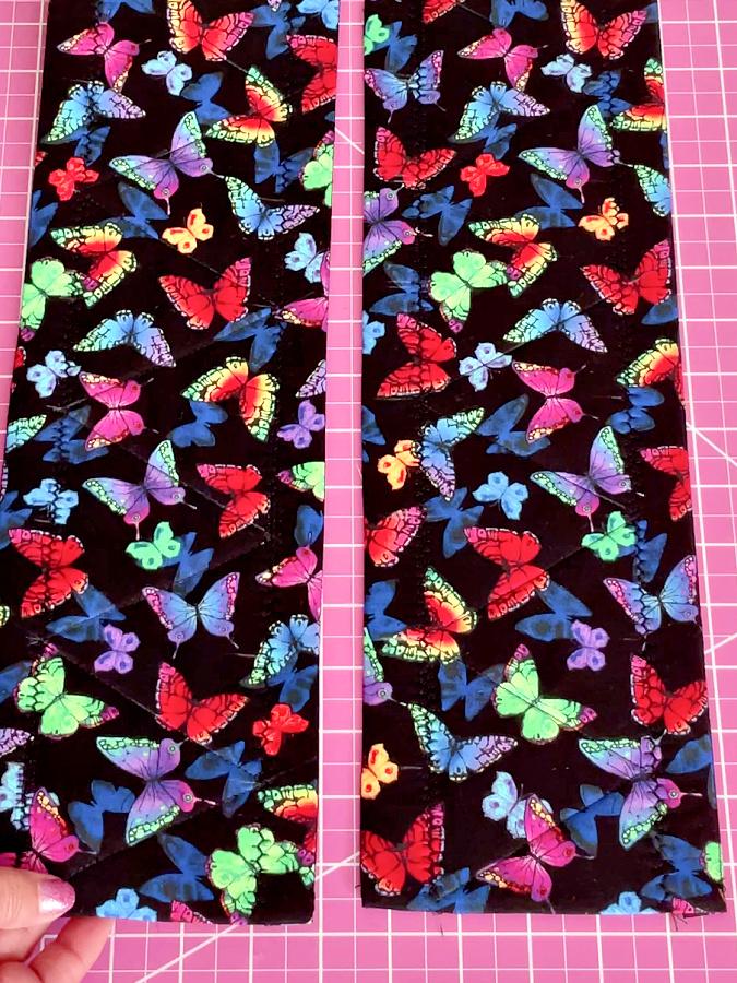 the two pieces prepared for the potholder laying down right side up on an ironing board