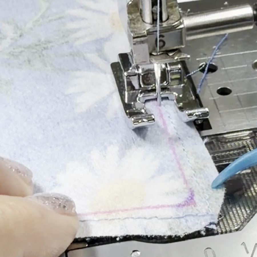 stitching the other part of the collar with the same open toe presser foot