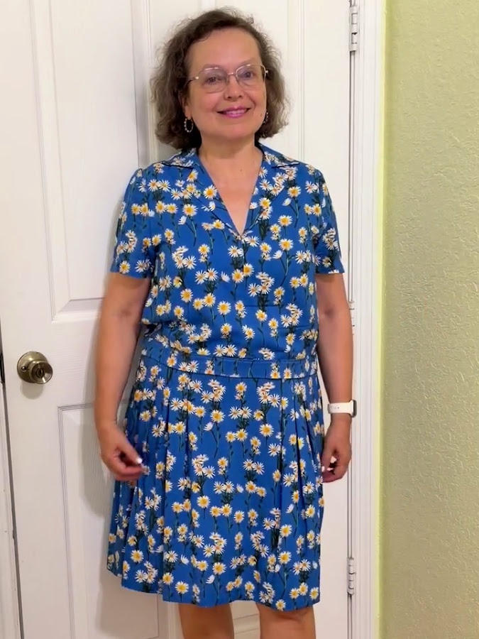 the skirt and blouse finished after the collar has been repaired