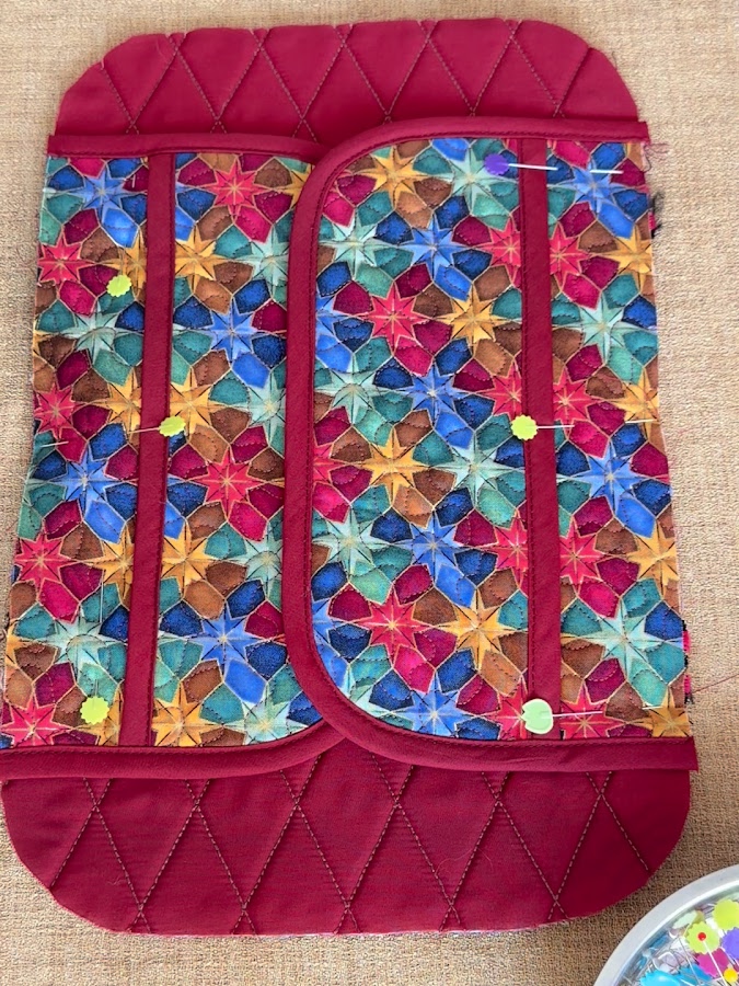 the side pockets positioned and pinned on the main panel of the organizer
