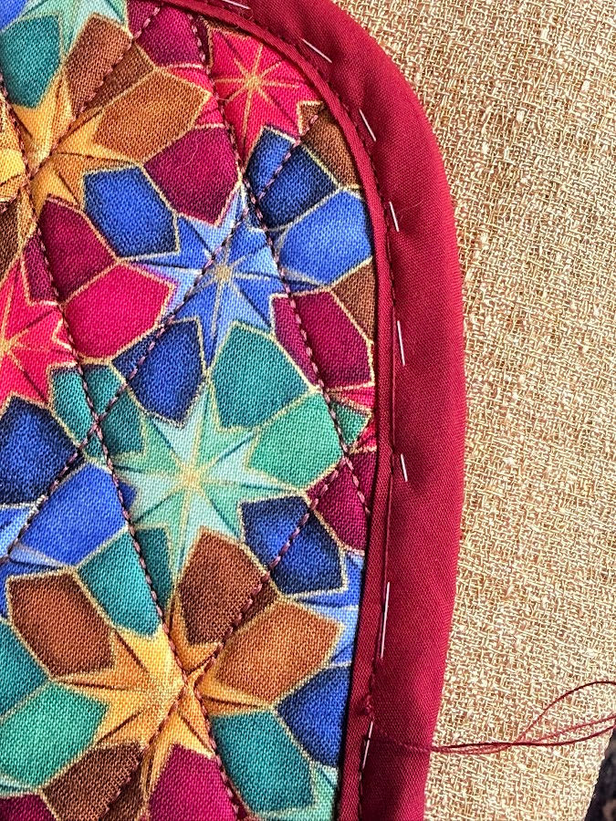 detail of a corner of the organizer showing skipped stitches
