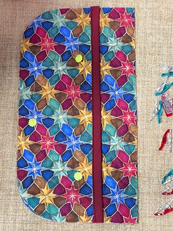 the pocket piece set on top of the main piece of the organizer the rounded edges aligned