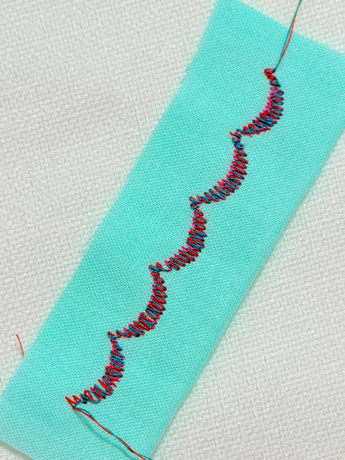 decorative stitch made using cotton embroidery thread the two colors red green are complementing each other