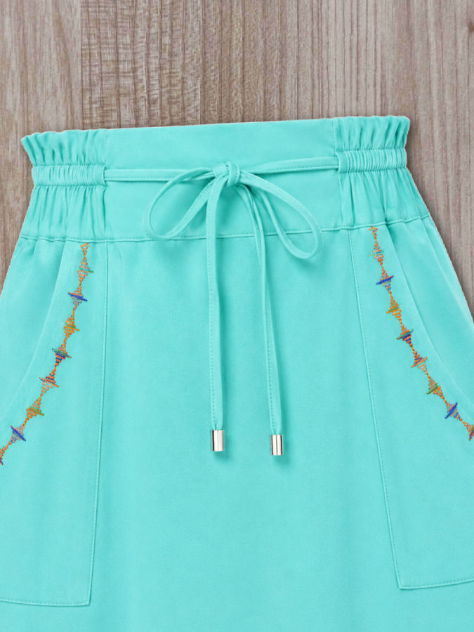 a skirt with two decorative stitches made using a double eye needle