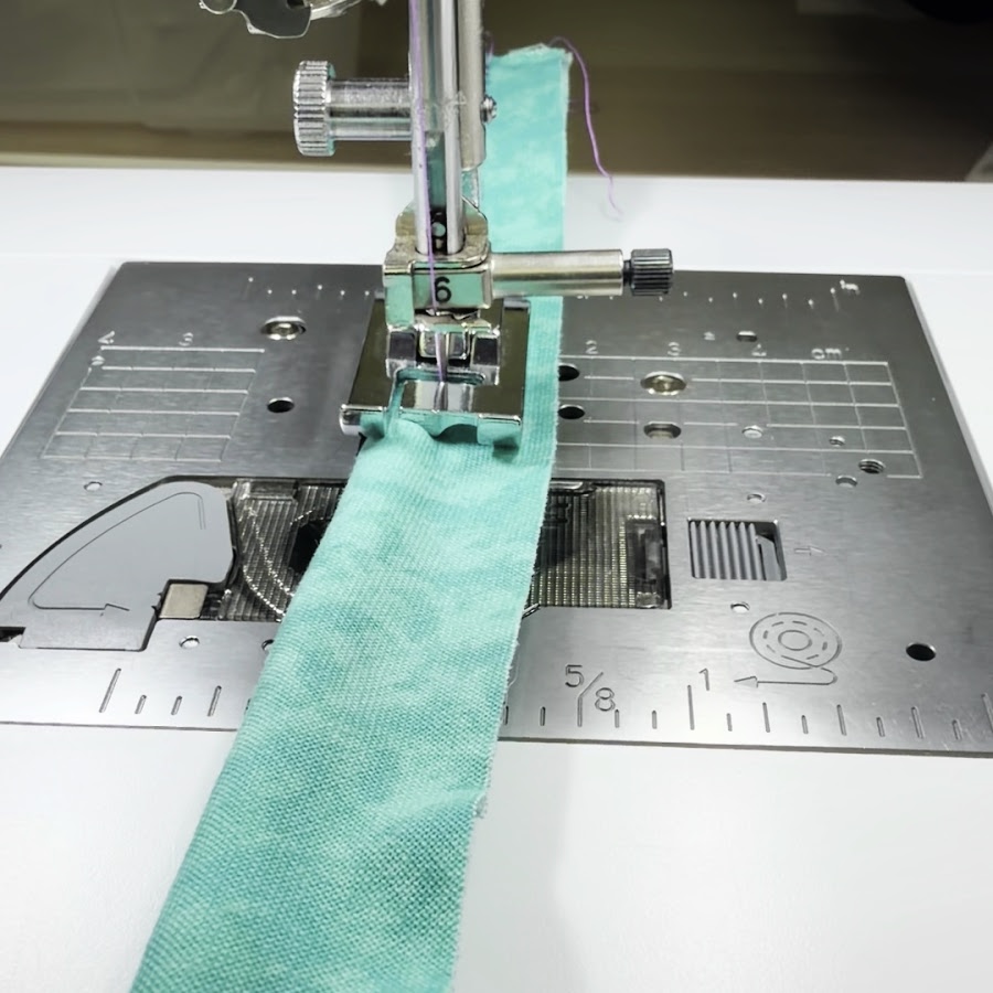 sewing machine needle assembly while sewing with the large pi[ping foot