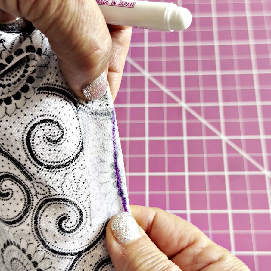 the stitching line marked along the cut after the fabric is folded and the two sides of the cut are aligned