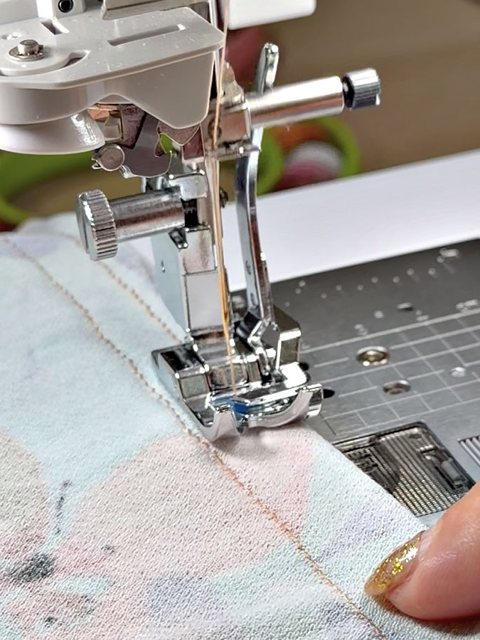 the knit presser foot installed in a sewing machine while sewing a stitch
