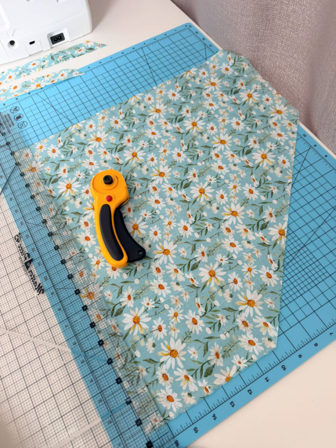 cutting the fabric strip along the grain