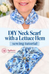 Close-up of a woman wearing a light blue floral lettuce-edge neck scarf, with the finished scarf arranged below on a light surface.
