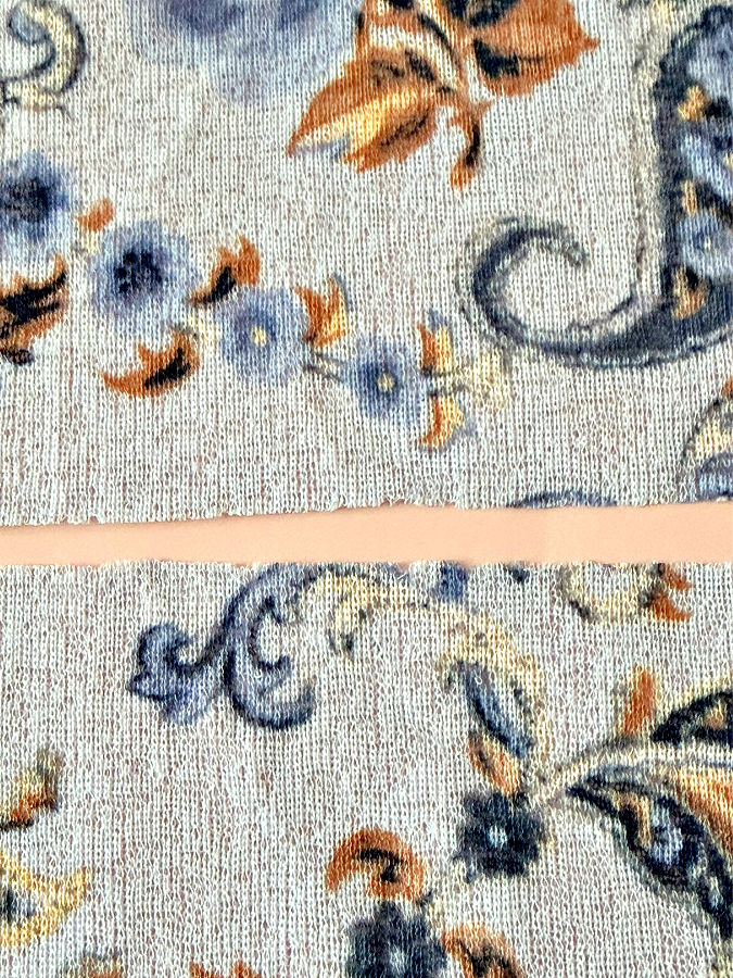 a closeup of the edges of the material where the lettuce hem will be sewn