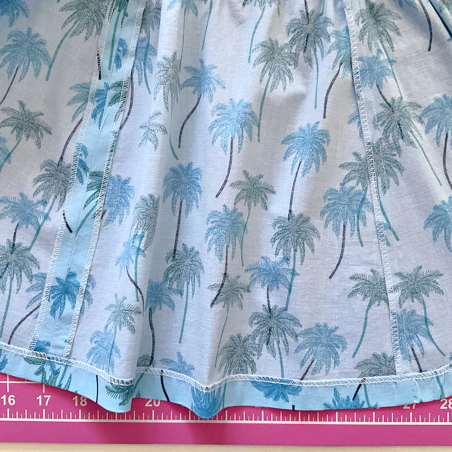 a garment laying on a cutting mat multiple types of seams are visible
