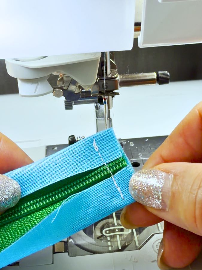 close up of the the stitch at the end of the zipper