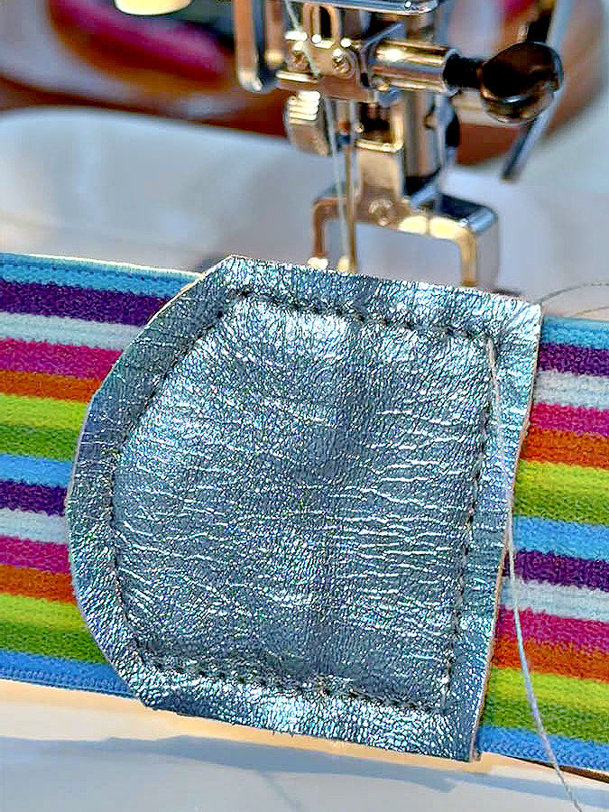 the leather stitched to the elastic