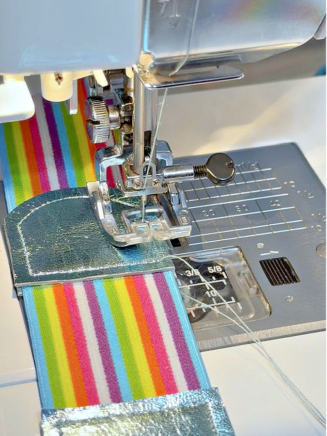 a sewing machine while stitching the leather to the elastic