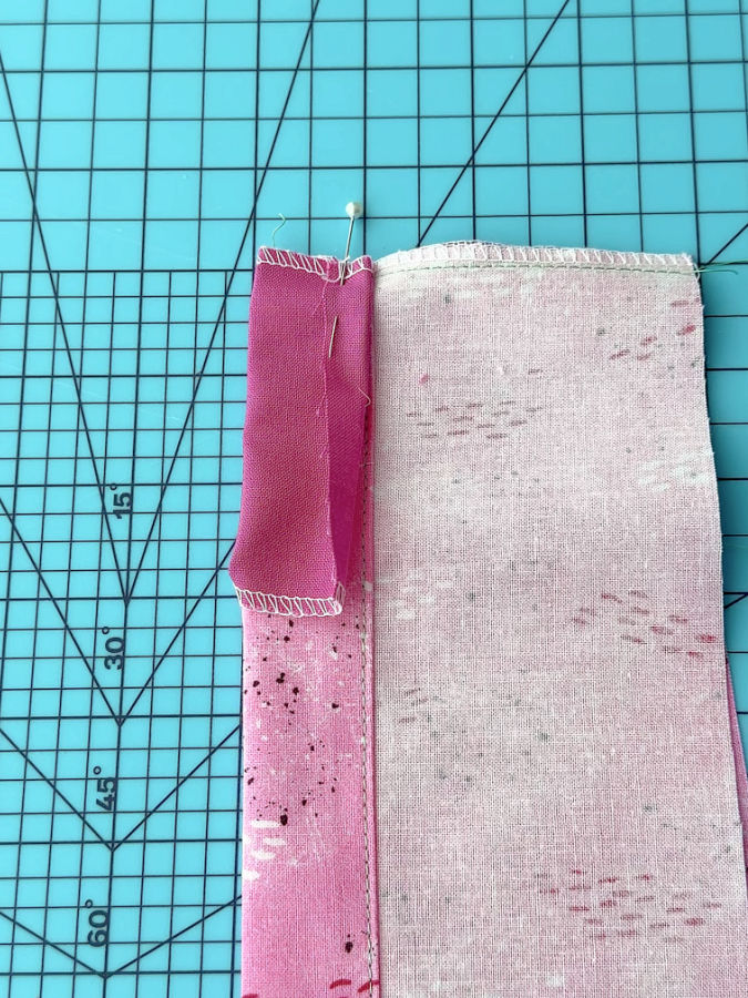 a pin is shown going through all layers of the original and insert materials